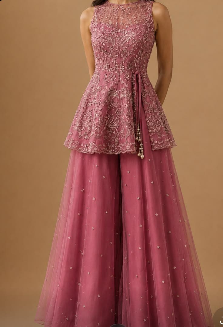 Rose pink peplum kurta with intricate pearl embroidery and flared sharara pants